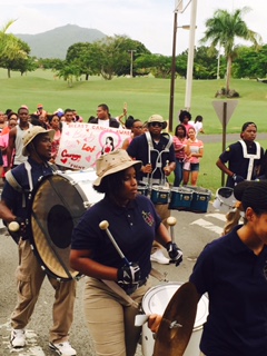 UVI students and marching band walk in honor of Breast Cancer Awareness